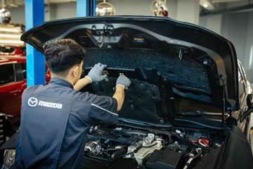 A person working on a car

AI-generated content may be incorrect.